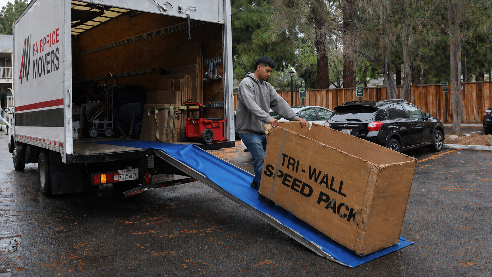 FairPrice Movers worker with speed pack on truck ramp