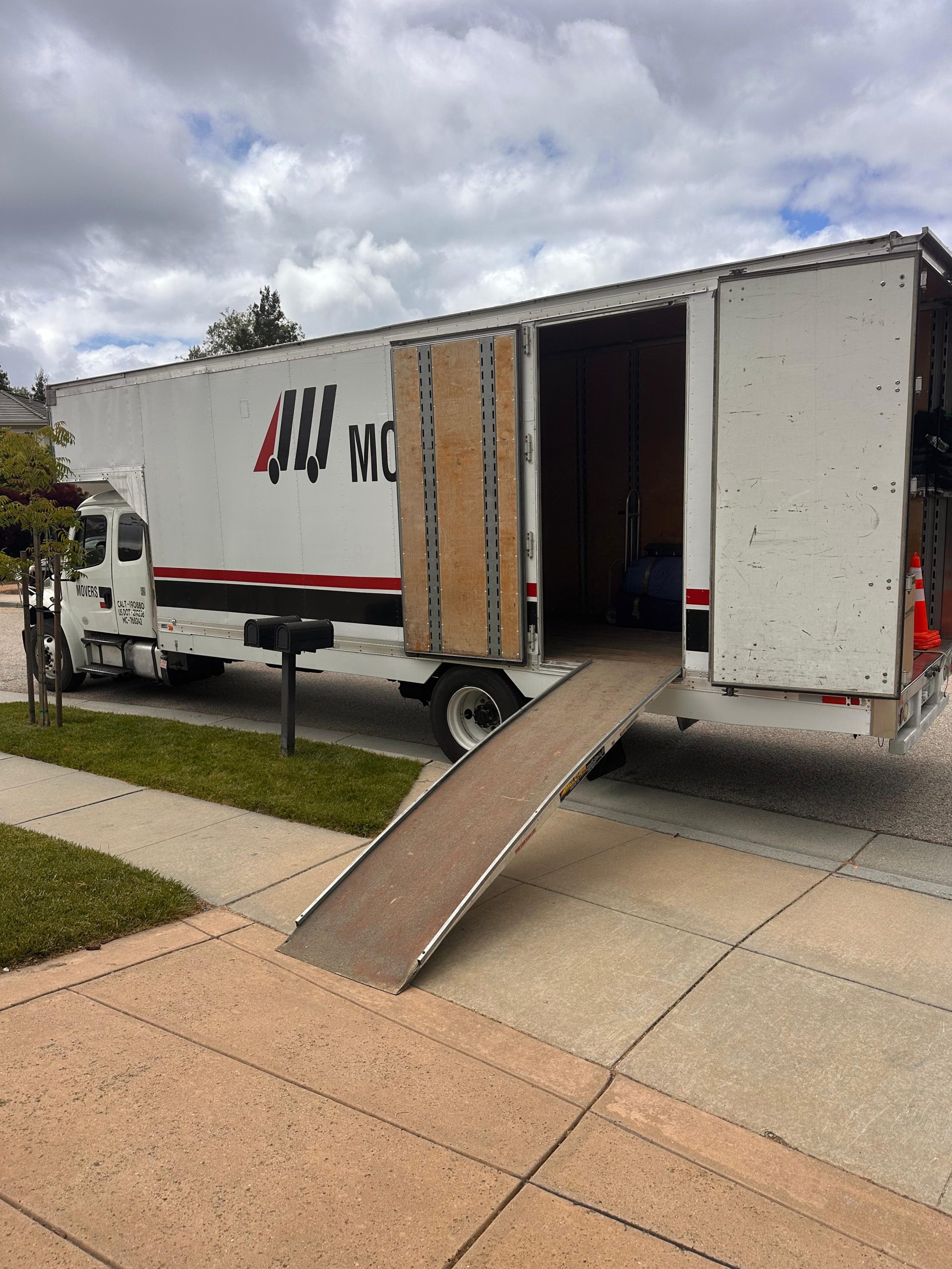 FairPrice Movers truck with side doors open