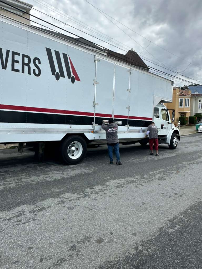 FairPrice Movers crew closing moving truck